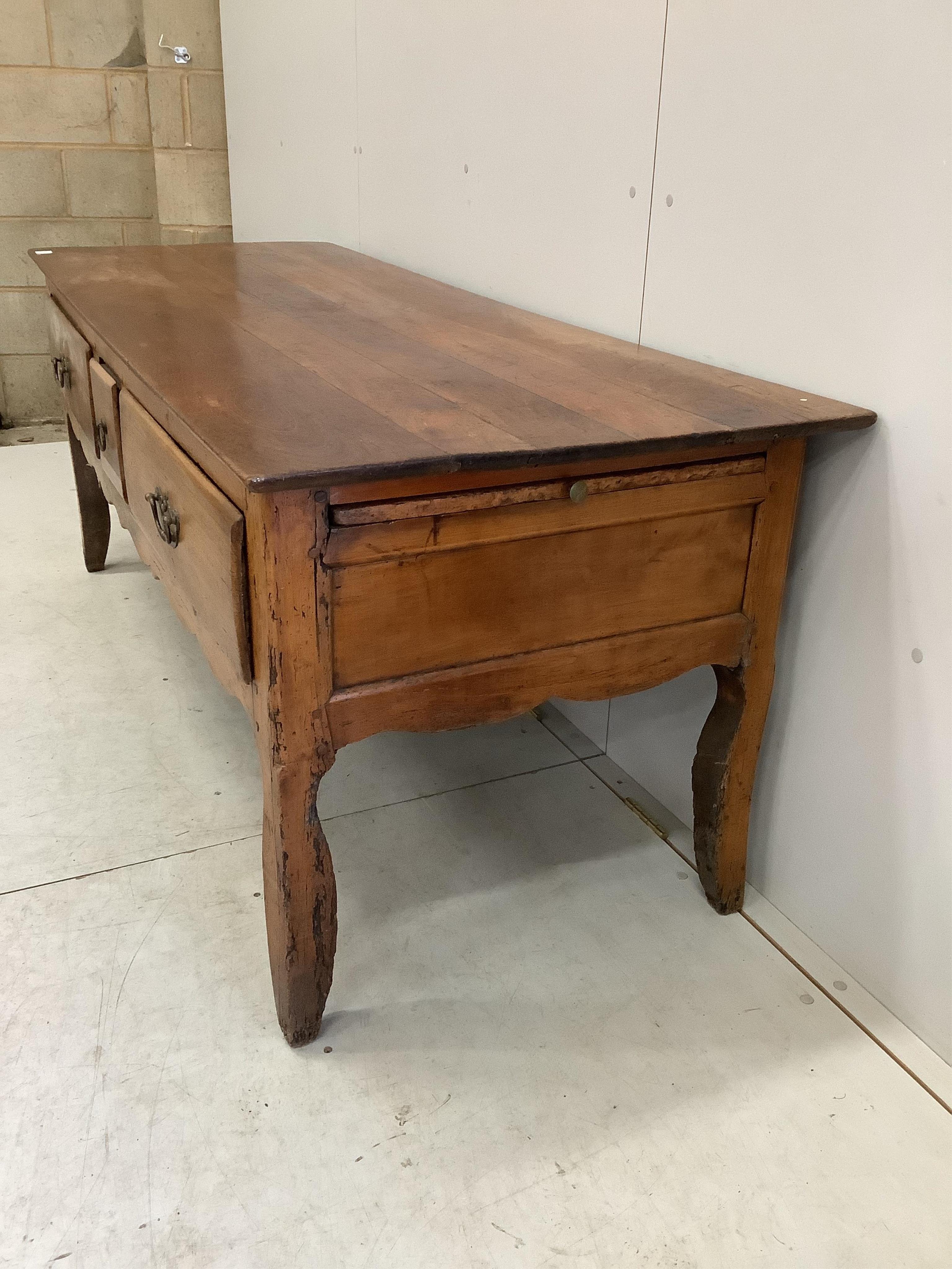A 19th century French three drawer serving table, width 181cm, depth 70cm, height 70cm. Condition - poor to fair